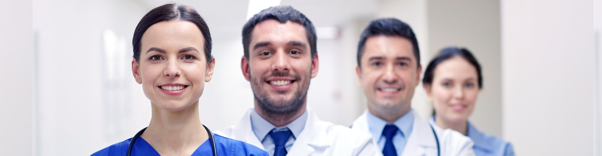 image of the four healthcare staff smiling